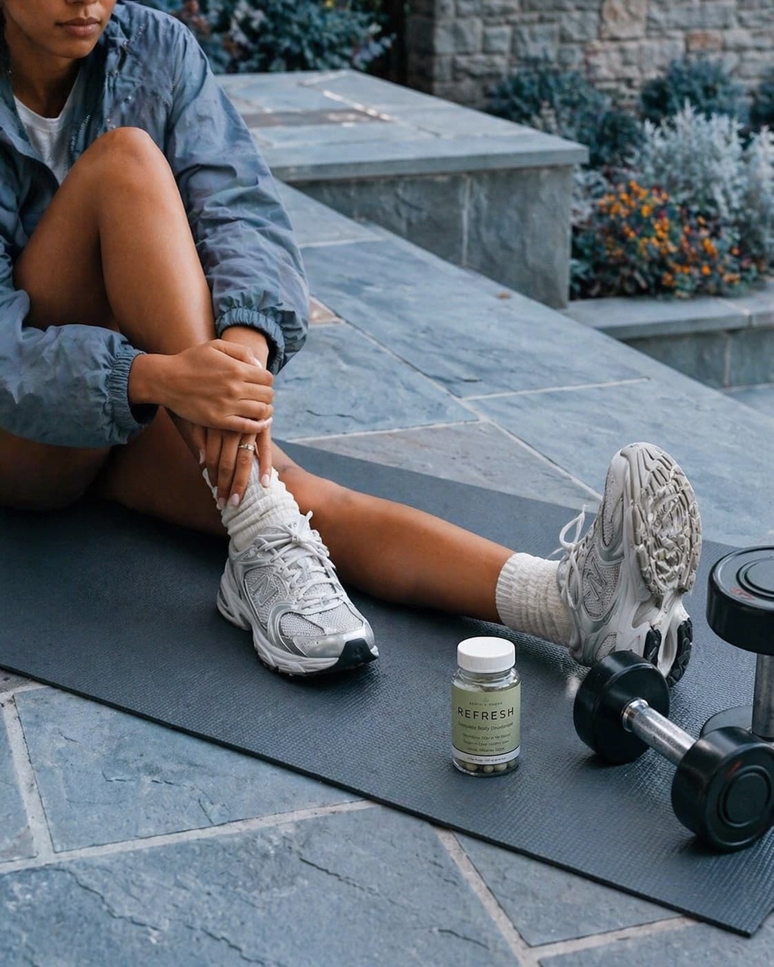 REFRESH beside training gear on stone steps, framed for heat, travel, and later plans.